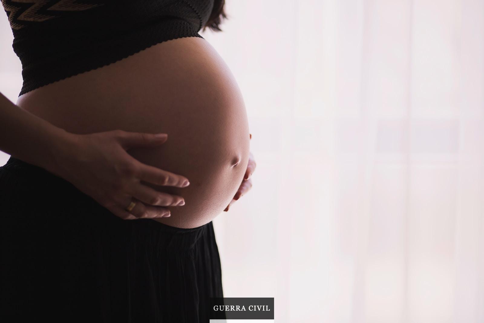 woman holding stomach